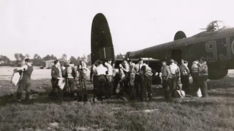 International Bomber Command Centre An archive image of men being kitted out with flying gear before climbing on board a Lancaster