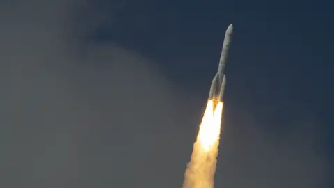 ESA/M. Pédoussaut Blasting bright flames from its rocket engines, Ariane 6 heads into orbit