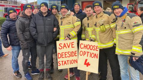 Firefighters and their supporters