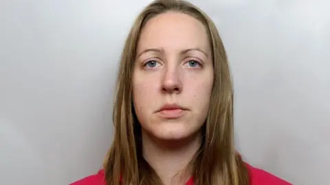 Cheshire Constabulary Mugshot of Lucy Letby in red hoody