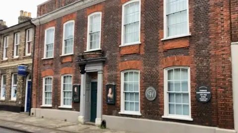 Luke Deal/BBC Red-brick Merchant House with white sash windows 