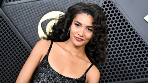 Olivia Dean on the red carpet at the Grammy Awards