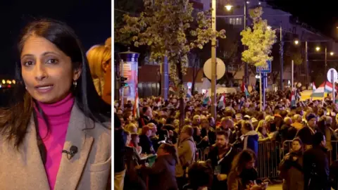 Composite image of Rajini Vaidyanathan in blazer and pictures of a crowd