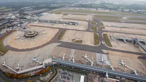 Getty Images: An aerial view of Gatwick Airport showing planes on the ground.