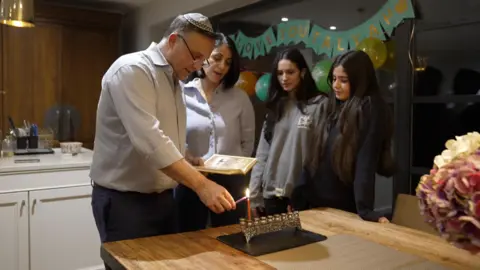 BBC The Sorenes light Chanukah candles after the last two months marked by worry over the Israel conflict and antisemitism