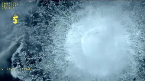 A screen grab from Danish Defense shows a gas leak causes bubbles on the surface of the water at Sea in Sweden on September 30, 2022