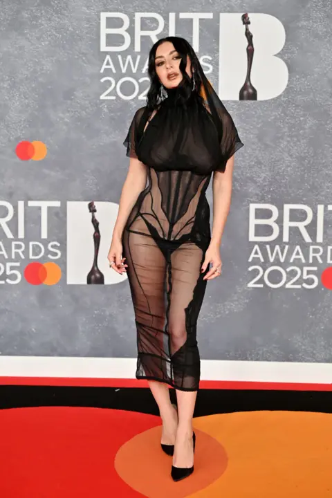 Getty Images Charli XCX on the red carpet dressed in black