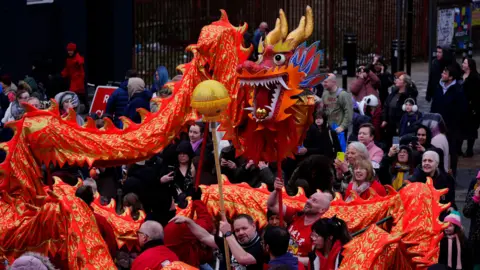 PA Media Performers from Liverpool Hung Gar Kung Fu School take part in the dragon dance for the Lunar New Year (also known as Chinese New Year) celebrations in Liverpool.