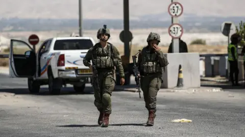 Getty Images Israeli forces investigate at the scene after a truck driver opened fire at the King Hussein (Allenby) Bridge across the Jordan River and the West Bank on September 8, 2024, near Jerico