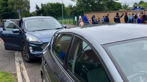 Cars parked outside Welton Primary School