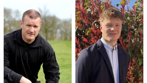 Thames Valley Police PC Andy Kemp left in all black dog handler uniform and his son Rhys on the right in a shirt and blazer stood in a garden.