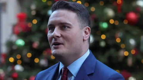 Reuters Wes Streeting in front of Christmas tree