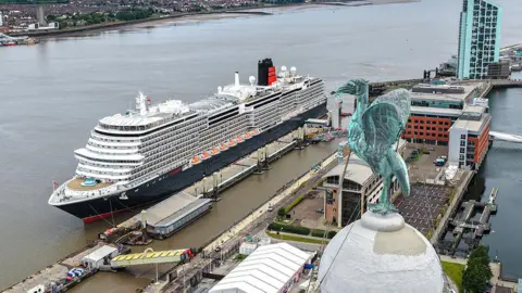 Stratus Imagery Aerial view taken above one of the Liver Birds of the Queen Anne Cunard cruise ship docked at Liverpool's Cruise Point.