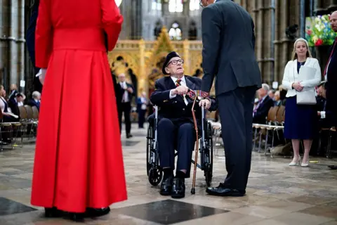 Jordan Pettitt/Pool/Getty Images Veteran Ken Hay arrives for a Service of Thanksgiving at Westminster Abbey in London on the 80th anniversary of VE Day on May 8, 2025 in London, England.