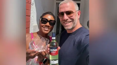 Jaxx Nelson Jaxx Nelson and Tom Bodfish outside the house smiling holding a bottle of Cinzano.