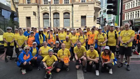 Jo Gennari Volunteers wearing yellow tops