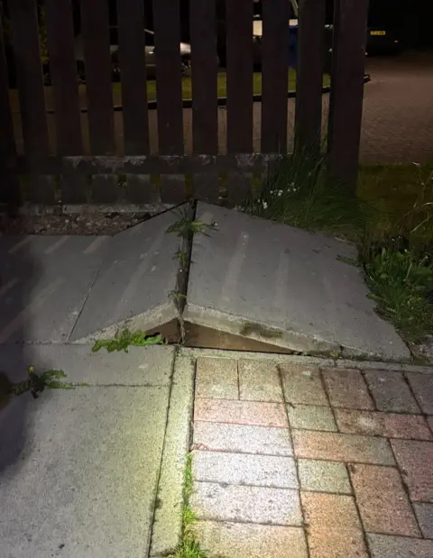 Mining Remediation Authority paving stones pushed upwards by ground movement on a residential street