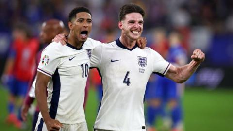 Jude Bellingham of England and Declan Rice of England celebrate with the fans after their sides victory the UEFA EURO 2024 round of 16 match between England and Slovakia.