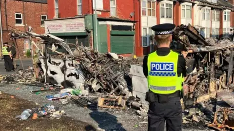 BBC Burnt-out bus in Harehills