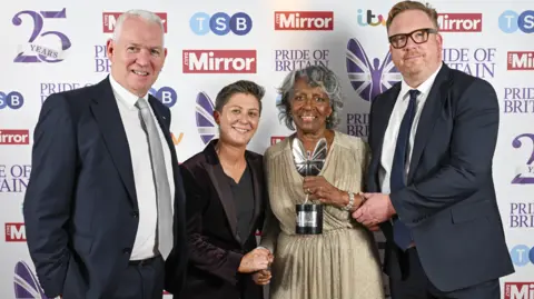 Andy Stenning and Rowan Griffiths / Daily Mirror Agness Nisbett (second right) at the Pride of Britain awards holding her trophy with three others