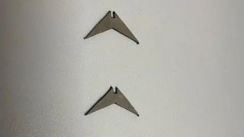 Natalie Alexander Metallic spikes which look like a boomerang with sharper edges.