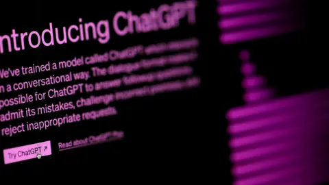 PA Media A black screen saying 'Introducing ChatGPT' in purple lettering