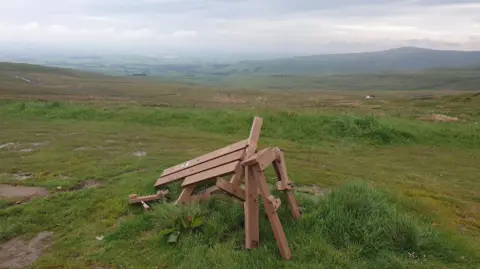 A picture of the broken bench at Hartside Summit View Point