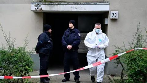 Getty A criminal investigation unit technician leaves a building believed to be the site where a German activist of the notorious far-left Red Army Faction (RAF) wanted for more than 30 years for attempted murder and other crimes has been arrested in Berlin, on February 27, 2024
