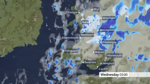 Met Office A map of Wales with sections in blue indicating weather events. Text in a white box at the bottom right of the map reads: Wednesday: 03:00
