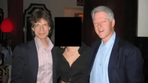 US Department of Justice Rolling Stones legend Mick Jagger is seen here posing with Clinton 