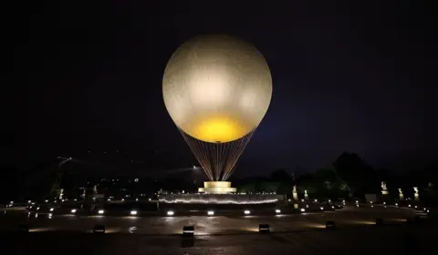   Marko Đurica/Reuters A view shows the large cauldron balloon at Jardin des Tuileries before it was lit on the day of the opening ceremony.