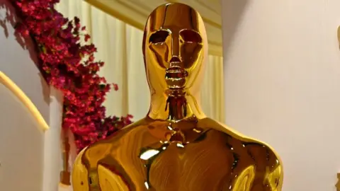 A close up image of an Academy Award trophy