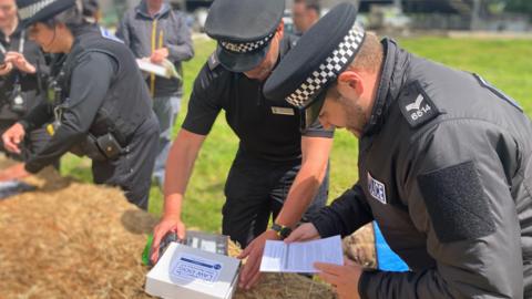 Officers training with DNA testing kits