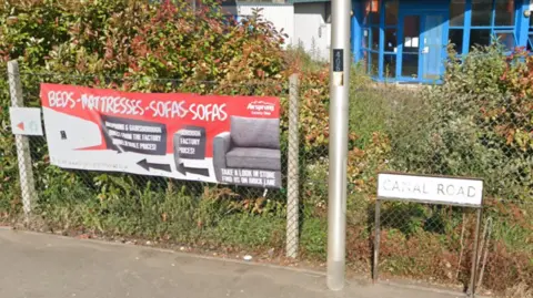 Google Maps A sign which says 'Canal Road' and a sign for 'beds, mattresses and sofas' with a logo for 'Airsprung'
