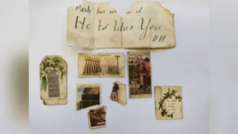 Beeston Methodist Church A collection of old items, including old cigarette cards and pieces of paper