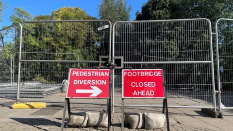 BBC Signs saying the bridge has been closed and there is a diversion