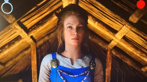 Powered by the insertion of a coin, the AI Viking waits to receive a new token so she can speak again.