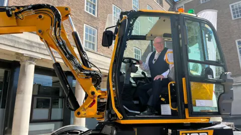 BBC Nottinghamshire County Council leader Mick Barton in a JCB Pothole Pro