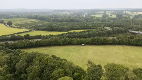 A green belt zone with plans for house building.