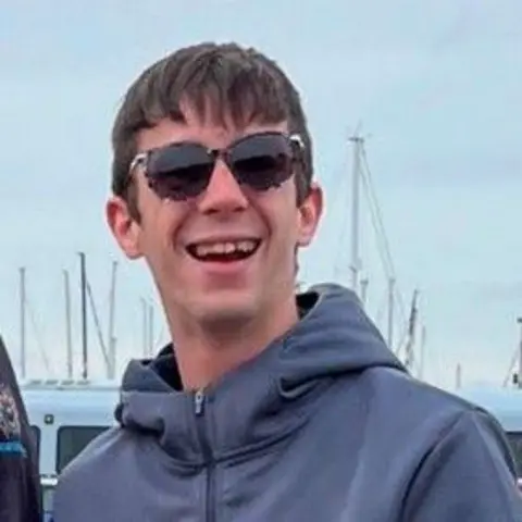 Hayden Davies smiling at the camera. 