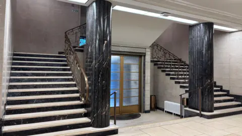 A colourful image of the double staircase, with very little appearing to be different from the original.
