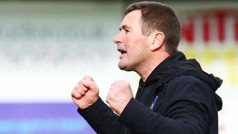 Mansfield boss Nigel Clough punches the air