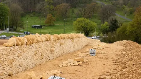 National Highways A stonewall being crafted along the A417