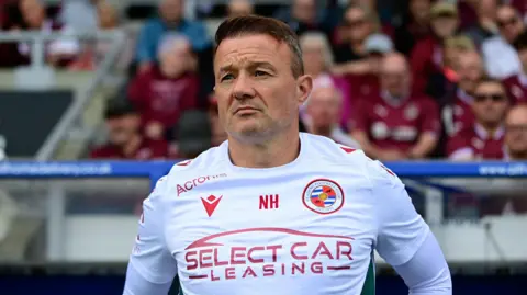 Reading boss Noel Hunt looks on before a game 