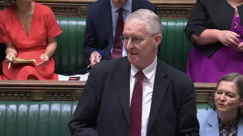 House of Commons Northern Ireland Secretary of State Hilary Benn standing up in the House of Commons