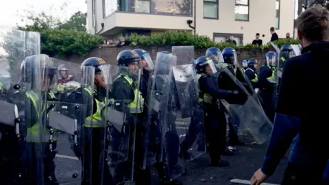 police and protestors clashing in Southampton during a protest following the death of Henry Nowak.