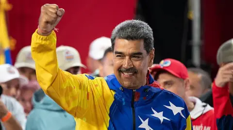 Getty Images President of Venezuela Nicolas Maduro celebrates after winning the presidential election on at Miraflores Palace July 28, 2024 in Caracas, Venezuela.