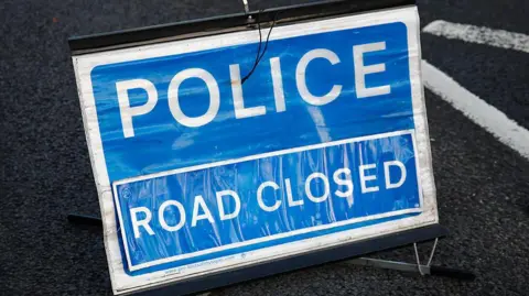 Police "road closed" sign