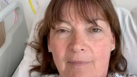 Lorraine Kelly seen in her hospital bed in a video posted on social media on Saturday