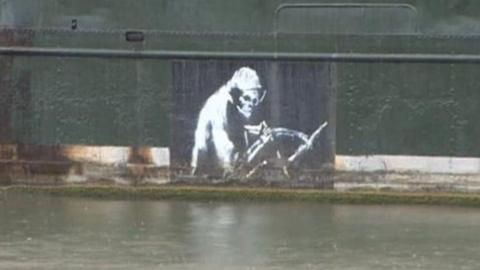Banksy's The Grim Reaper painted on the side of the Thekla Social boat moored in Bristol harbour,